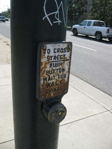 To cross street → push button wait for walk signal